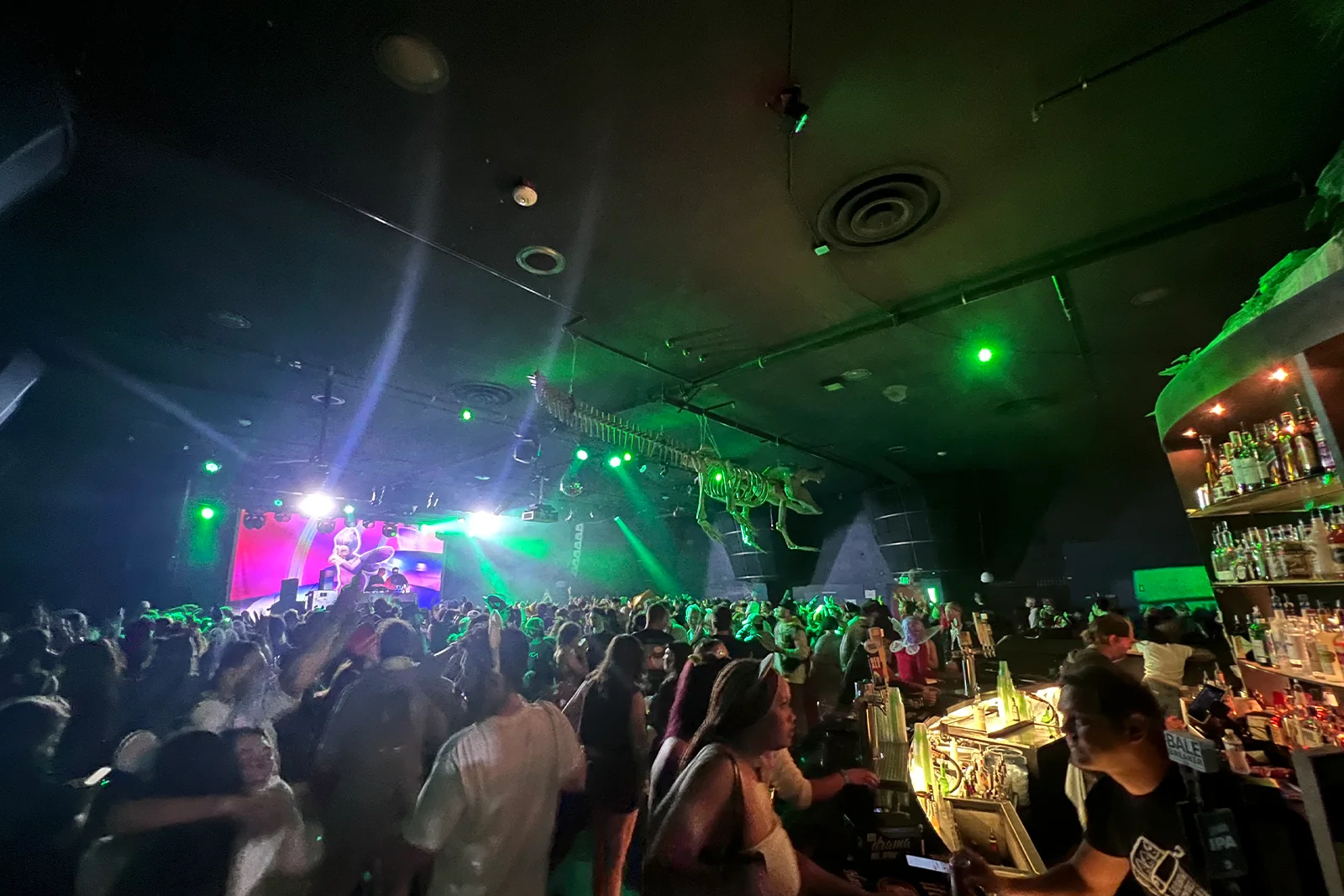 Packed crowd enjoying a live concert at The Crocodile in Seattle with colorful stage lights