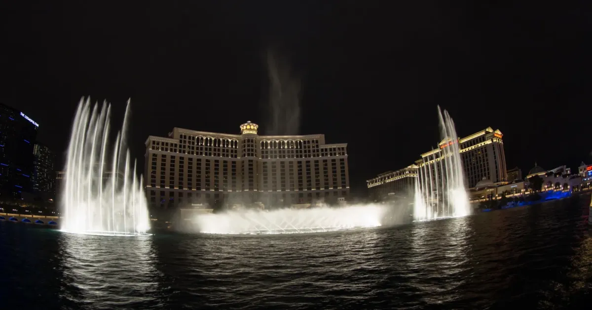 Bellagio fountain show illuminated at night on the Las Vegas Strip