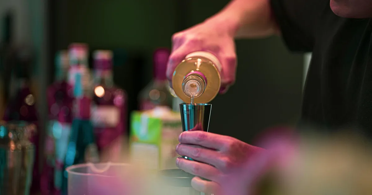 Couple making tropical cocktails during a Miami mixology class