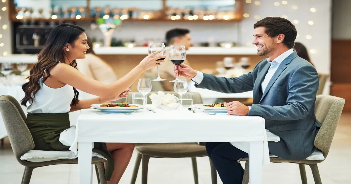 Couple toasting at a Winter Park restaurant on Park Avenue