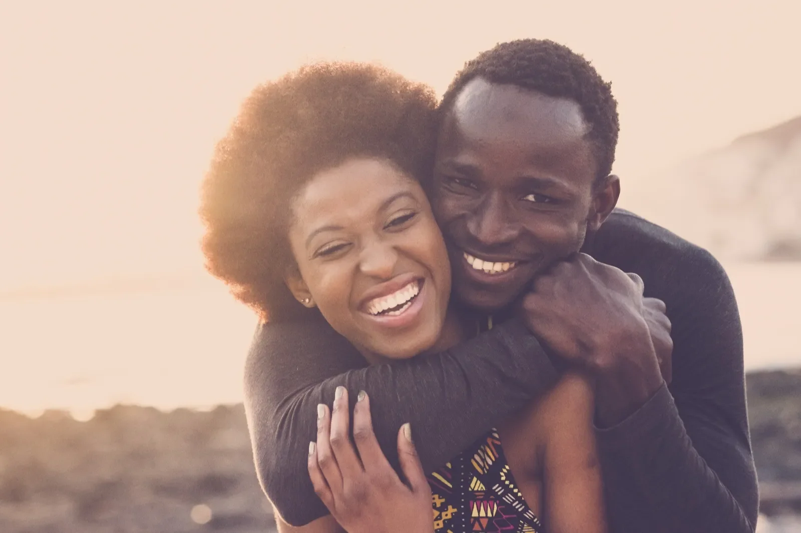 Couple laughing together, representing genuine relationship compatibility