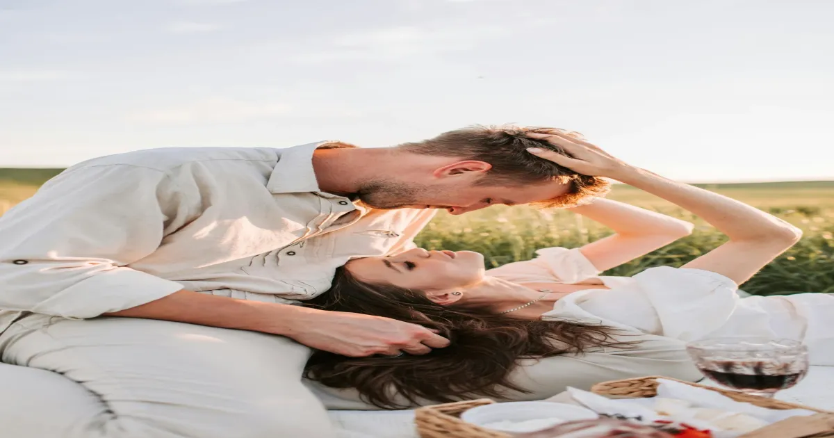 Couple writing love letters together on a date night at home
