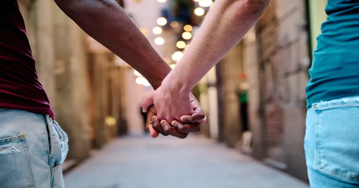 Couple walking hand in hand, representing aligned compatibility and shared direction