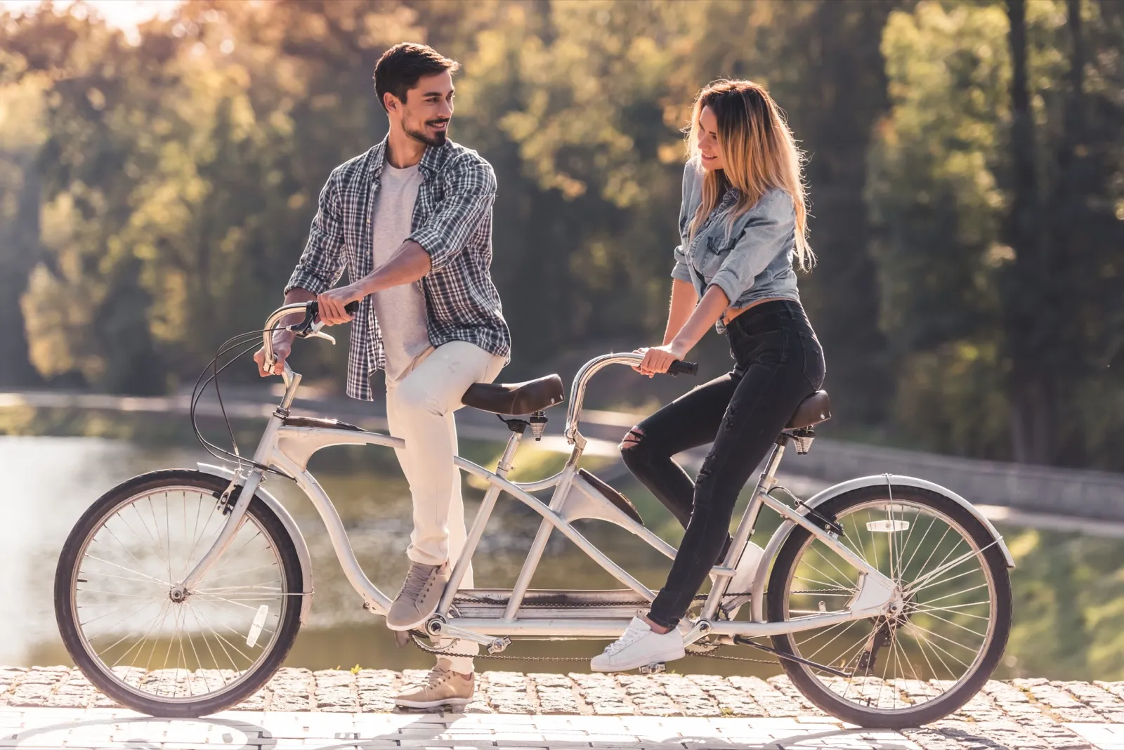 Couple biking through Oleta River State Park trails in Miami