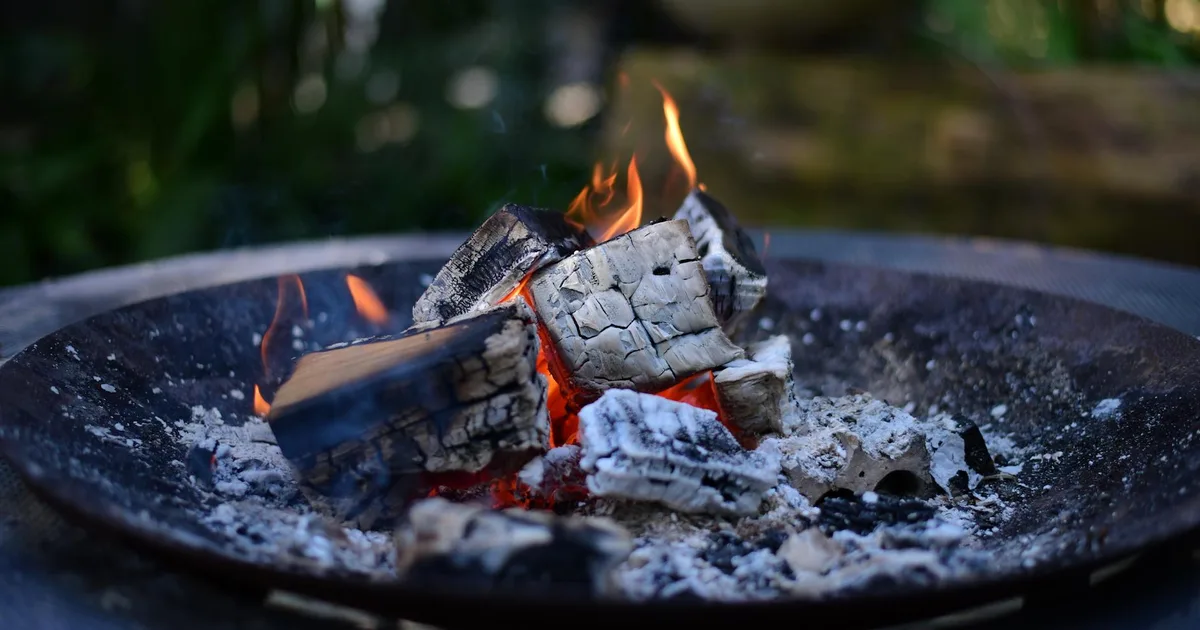 Beach bonfire anniversary date under the stars - budget-friendly romantic idea