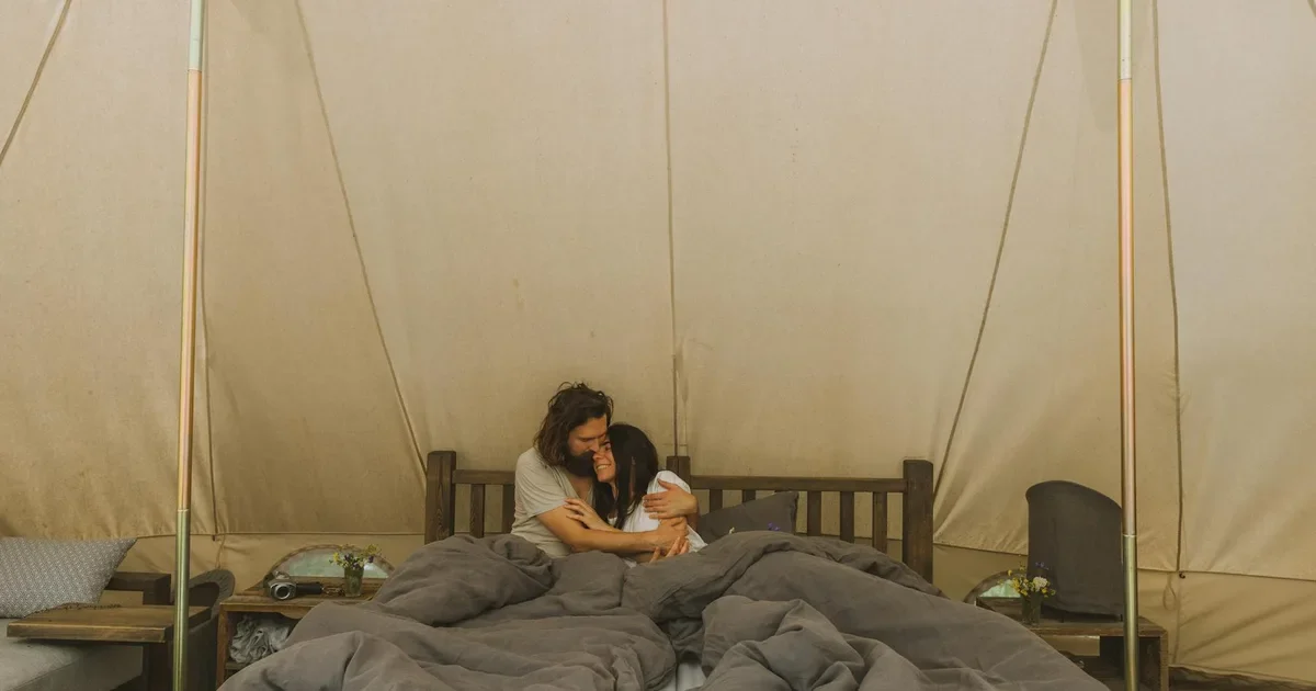 Couple camping under the stars on a romantic date