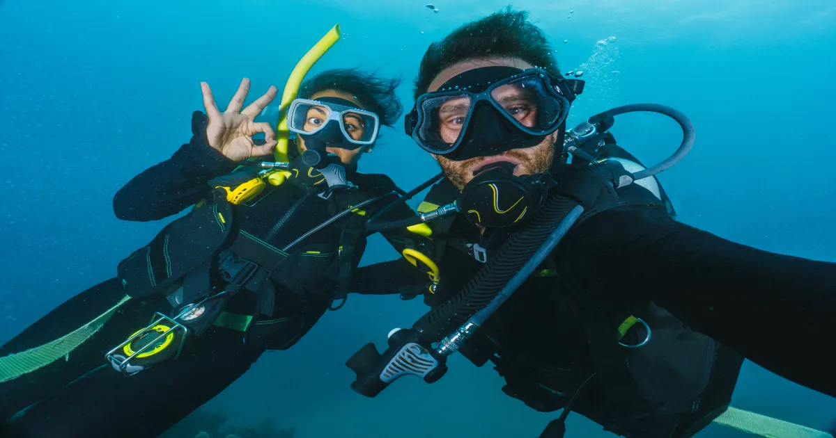 Couple snorkeling underwater on La Jolla adventure date in San Diego