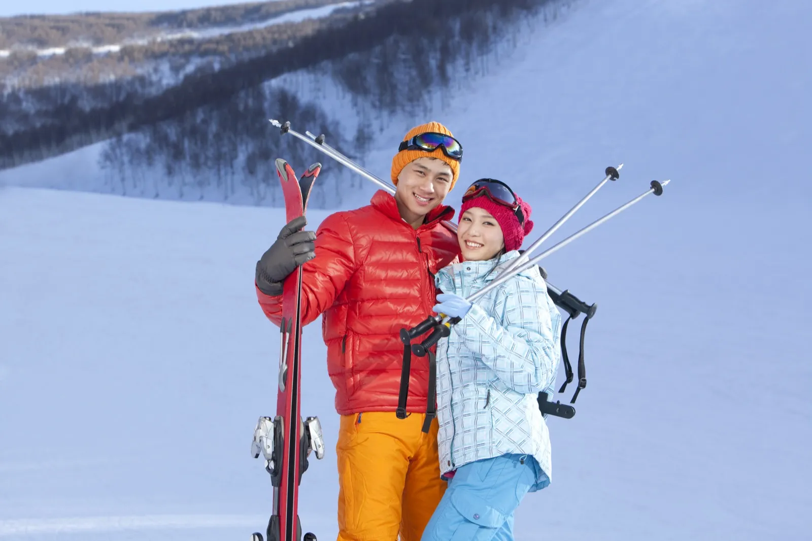 Couple at a ski resort near Denver enjoying fresh powder