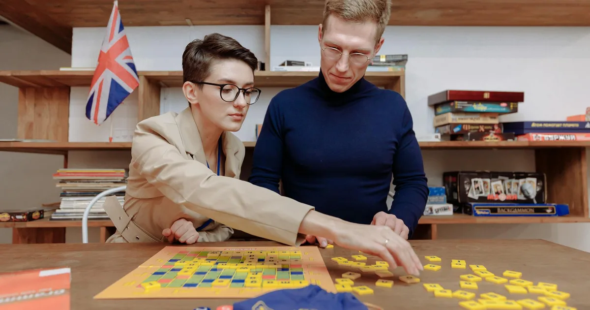 Couples playing at board game café on a fun group date